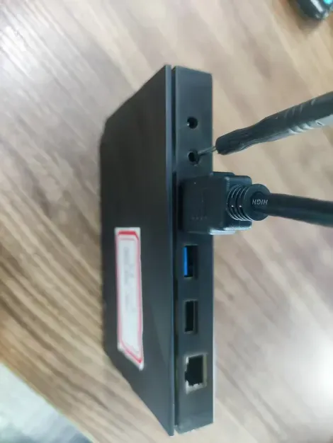 vSeeBox reset button pinhole on the back of the device next to the AV interface